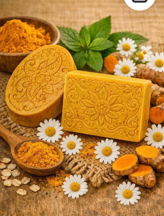 Goat Milk Base Turmeric soap bars in golden yellow, with an ornate floral pattern and embossed decorative designs