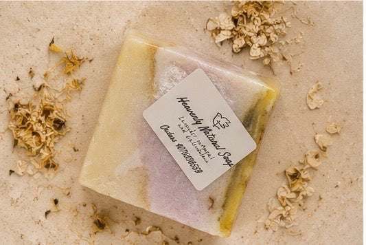 Soap bar Lavender Oatmeal and Calendula with a pale yellow edge, lavender-toned center, and wrapped label