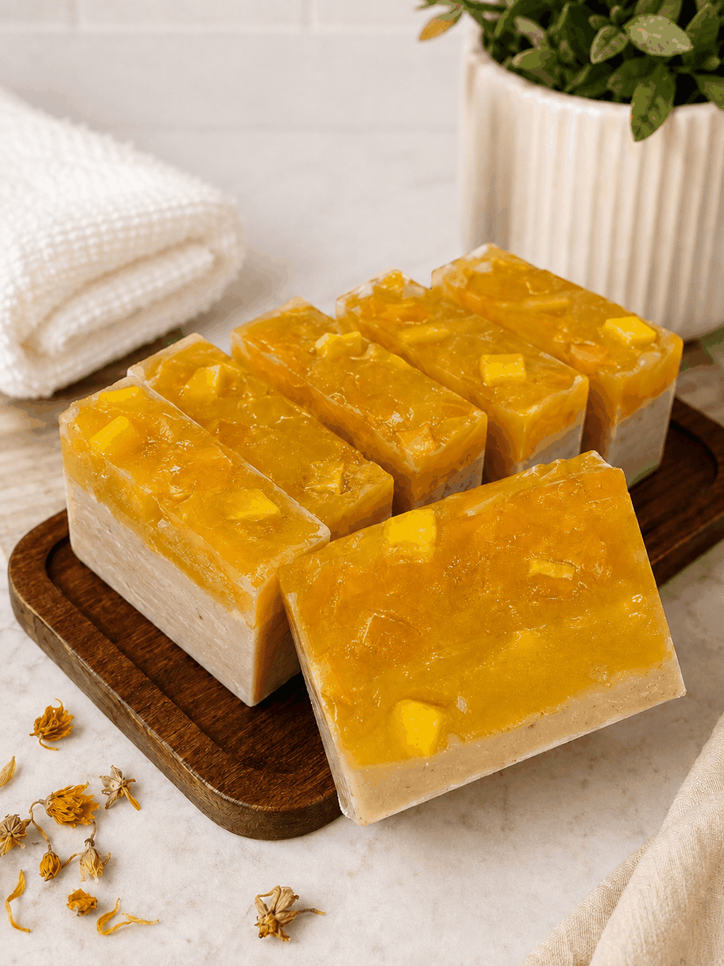 Patchouli Soapbar with a vivid amber-orange top, creamy beige base and visible chunky botanical pieces.