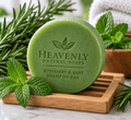 Rosemary Mint Shampoo Bar, round green solid shampoo with embossed Heavenly Natural Soaps branding and rosemary mint label